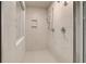 Walk-in shower featuring stylish tile work, a shower bench, and modern fixtures at 428 Hatcher Ct, Hampton, GA 30228