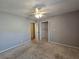 Bedroom with carpeted floors, ceiling fan and closet access, ready for personalization at 5685 Mccoy Nw Rd, Acworth, GA 30101