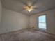 Bedroom featuring a window that provides natural light and carpeted flooring at 5685 Mccoy Nw Rd, Acworth, GA 30101