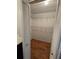 Walk-in closet with hardwood floors and wire shelving at 5685 Mccoy Nw Rd, Acworth, GA 30101