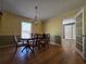 Formal dining room featuring a chandelier, hardwood floors, and access to an additional room at 5685 Mccoy Nw Rd, Acworth, GA 30101