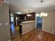 Open kitchen featuring stainless steel appliances, granite countertops, hardwood floors and open to breakfast area at 5685 Mccoy Nw Rd, Acworth, GA 30101
