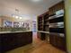 Modern kitchen features stainless steel appliances, granite countertops, storage shelves, and plenty of cabinet space at 5685 Mccoy Nw Rd, Acworth, GA 30101