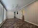 Bright sun room with large windows, tile floors, a ceiling fan and access to a door to the backyard at 5685 Mccoy Nw Rd, Acworth, GA 30101
