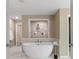 Relaxing bathroom featuring an inviting standalone tub, a separate shower, and modern finishes at 141 Compass Rd, Hampton, GA 30228