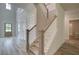 Spacious entryway with plank floors, open staircase, and a view of the entrance at 141 Compass Rd, Hampton, GA 30228