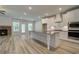 Modern kitchen with stainless steel appliances, center island, and open to living area at 141 Compass Rd, Hampton, GA 30228