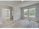 Open Living area, plank flooring and many windows allow for lots of natural light at 141 Compass Rd, Hampton, GA 30228