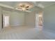 Bright main bedroom offering ample space, and providing access to both a bathroom and another room at 141 Compass Rd, Hampton, GA 30228