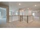 Bright upstairs hallway featuring neutral paint, white banisters, and doorways to multiple rooms at 141 Compass Rd, Hampton, GA 30228