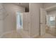 Spacious walk-in closet featuring wire shelving and an entry to the primary bathroom area at 141 Compass Rd, Hampton, GA 30228
