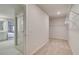 Walk-in closet with carpet floors, metal shelving, and open doorway to the bathroom at 145 Compass Rd, Hampton, GA 30228