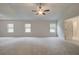 Spacious main bedroom with multiple windows for natural light and relaxing ambiance at 145 Compass Rd, Hampton, GA 30228