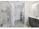 Bathroom with glass enclosed shower, gray tiles, and modern vanity at 319 Hayden Cir, Woodstock, GA 30189