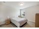 Cozy bedroom featuring carpet, neutral walls and furnishings and a window at 319 Hayden Cir, Woodstock, GA 30189