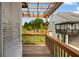 Outdoor deck showcasing wood railings and a trellis, providing a private view of greenery at 319 Hayden Cir, Woodstock, GA 30189