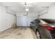 Spacious garage with concrete floor and modern door with car parked inside at 319 Hayden Cir, Woodstock, GA 30189