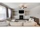 Cozy living room with fireplace, built-in shelving, plush seating and lots of natural light at 319 Hayden Cir, Woodstock, GA 30189