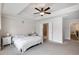 Cozy main bedroom features neutral tones, carpeted floor, and tray ceiling at 319 Hayden Cir, Woodstock, GA 30189