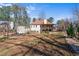 Expansive backyard featuring a large deck, storage shed, and mature trees at 3850 Pilgrim Mill Rd, Cumming, GA 30041