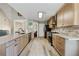 Modern kitchen with light wood cabinets, stainless steel appliances, and a spacious countertop at 3850 Pilgrim Mill Rd, Cumming, GA 30041