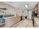 Bright, open kitchen featuring light wood cabinets, quartz countertops, and stainless steel appliances at 3850 Pilgrim Mill Rd, Cumming, GA 30041