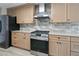 Well-equipped kitchen with stainless steel appliances and light wood cabinetry at 3850 Pilgrim Mill Rd, Cumming, GA 30041