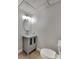 Modern bathroom features a vessel sink, a grey cabinet, and white toilet at 1083 Stoney Creek Ln, Austell, GA 30168