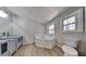 Bathroom with a garden tub, a double vanity, and light wood flooring at 1083 Stoney Creek Ln, Austell, GA 30168