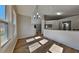 Dining area with large windows providing natural light that complements the modern flooring and neutral wall colors at 1083 Stoney Creek Ln, Austell, GA 30168