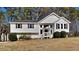 Charming home featuring traditional style, a well-maintained yard and a neatly trimmed landscape with mature trees at 1083 Stoney Creek Ln, Austell, GA 30168