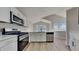 Modern kitchen featuring stainless steel appliances, light cabinetry, ample countertop space and hardwood floors at 1083 Stoney Creek Ln, Austell, GA 30168