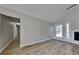 Bright living room showcasing modern flooring, fresh paint, a window and fireplace at 1083 Stoney Creek Ln, Austell, GA 30168