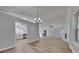 Open-concept living room showcasing modern flooring, fresh paint, and abundant natural light with stylish ceiling fan at 1083 Stoney Creek Ln, Austell, GA 30168