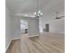 Bright living room featuring a chandelier, ceiling fan, light walls and modern flooring at 1083 Stoney Creek Ln, Austell, GA 30168