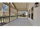 Covered back porch with view of trees and backyard at 1083 Stoney Creek Ln, Austell, GA 30168