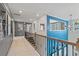 Second floor hallway with wrought iron bannister and open view to living space at 137 Compass Rd, Hampton, GA 30228