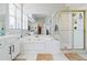 A bathroom featuring a glass shower, a garden tub, and & sinks at 325 Stonecastle Pass, South Fulton, GA 30331