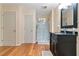 Bathroom with a black vanity, glass shower, and modern fixtures, showcasing a clean design at 325 Stonecastle Pass, South Fulton, GA 30331