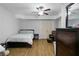 Neutral bedroom with a comfortable bed, ceiling fan, and closet, creating a relaxing atmosphere at 325 Stonecastle Pass, South Fulton, GA 30331