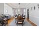 Elegant dining room with tray ceiling and modern lighting fixture. Perfect for entertaining guests at 325 Stonecastle Pass, South Fulton, GA 30331