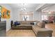 Inviting living area with a comfortable sectional sofa and views into adjacent spaces at 325 Stonecastle Pass, South Fulton, GA 30331