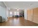 Open-concept living area with hardwood floors, ample natural light, and access to other areas of the home at 325 Stonecastle Pass, South Fulton, GA 30331