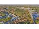 An aerial view of homes in the neighborhood showcases its proximity to surrounding wooded areas and highway at 382 Daffodil Dr, Temple, GA 30179