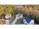 A view of several homes in the neighborhood shows how close they are to the surrounding trees at 382 Daffodil Dr, Temple, GA 30179