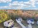 Aerial view of craftsman style homes with long driveways and fall foliage in the background at 382 Daffodil Dr, Temple, GA 30179