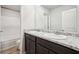 A full bathroom with granite countertops and a double sink vanity at 382 Daffodil Dr, Temple, GA 30179