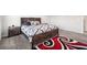 Bedroom with area rug, carpet, dark wood bedroom set, and natural lighting at 382 Daffodil Dr, Temple, GA 30179