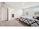 Bright bedroom featuring plush carpeting, natural light, and ensuite bathroom access at 382 Daffodil Dr, Temple, GA 30179