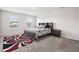Bedroom with area rug, carpet, dark wood bedroom set, and natural lighting at 382 Daffodil Dr, Temple, GA 30179